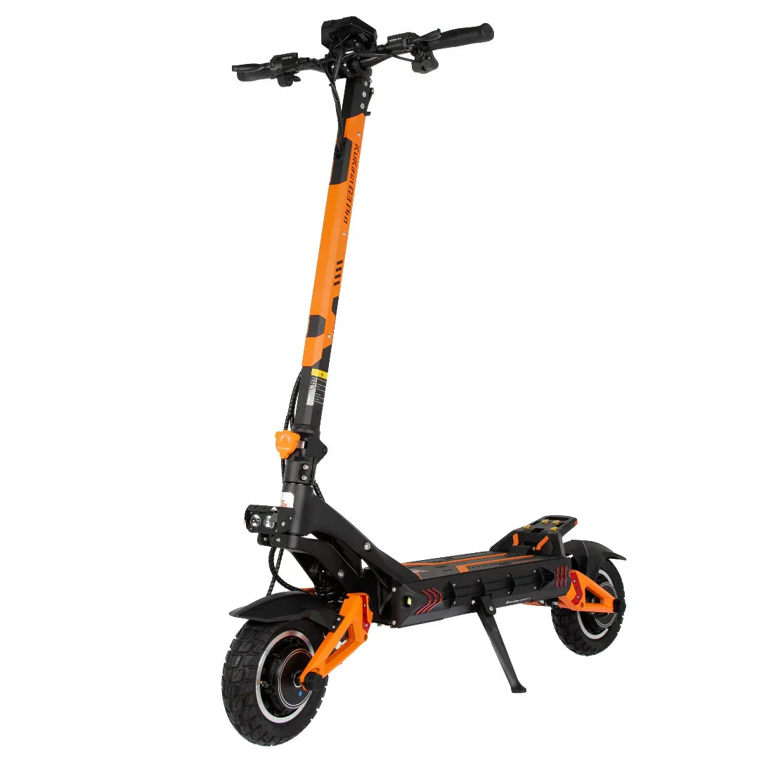 Orange and black electric scooter with large off-road tires and kickstand, ready for urban or trail rides.