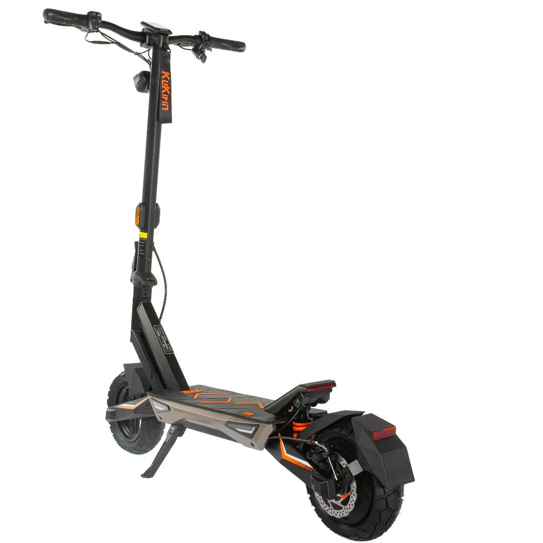Black and orange electric scooter with thick tires and suspension, ideal for urban commuting and off-road paths.
