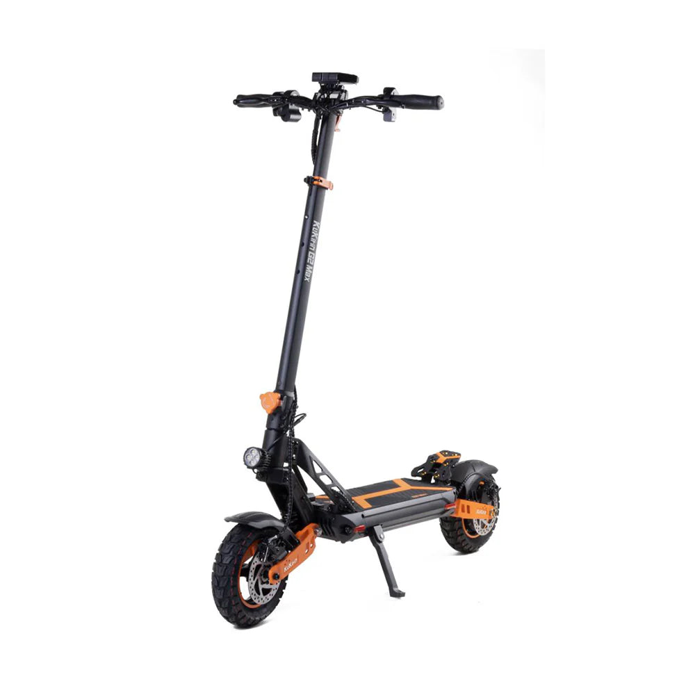 Black and orange electric scooter with thick tires and front light, standing on kickstand