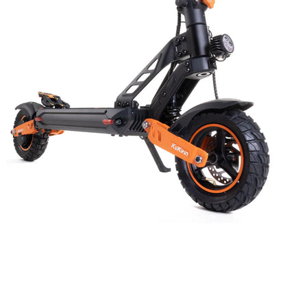 Black and orange electric scooter with fat tires and front light, brand name visible on frame