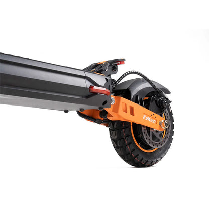 Orange and black electric scooter rear wheel with disc brake and rugged tire, KuKihin branding visible